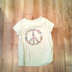 Feel comfortable shirt with a peace sign on it